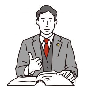 グッドサインをする弁護士